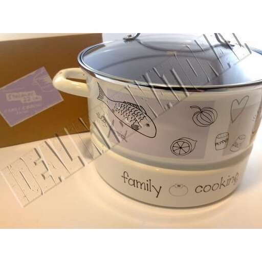 a pot with a lid and a spoon in it.