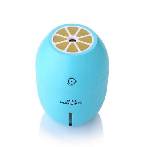 a computer mouse with a lemon on it.