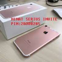 a pink iphone with a silver case.