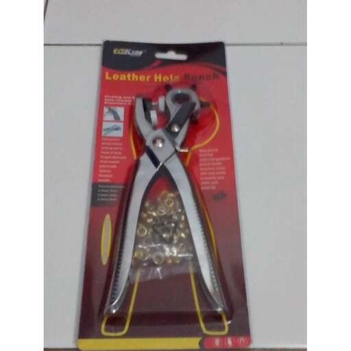 a pair of scissors is on a table.