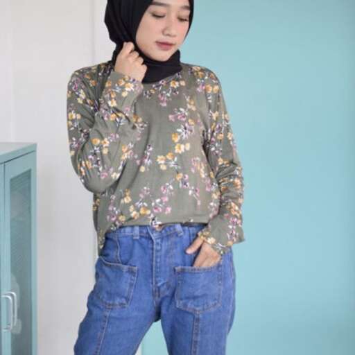 person, a floral blouse with a floral pattern.