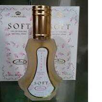 perfume in a box on a glass table