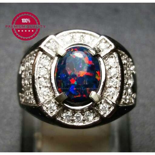 a ring with a sapphire and diamond