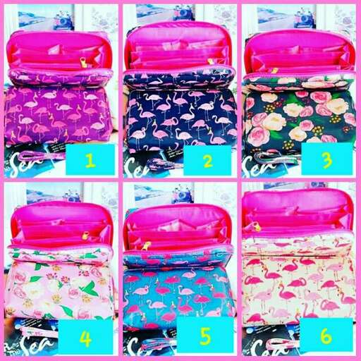 a pink suitcase with a floral pattern on it.