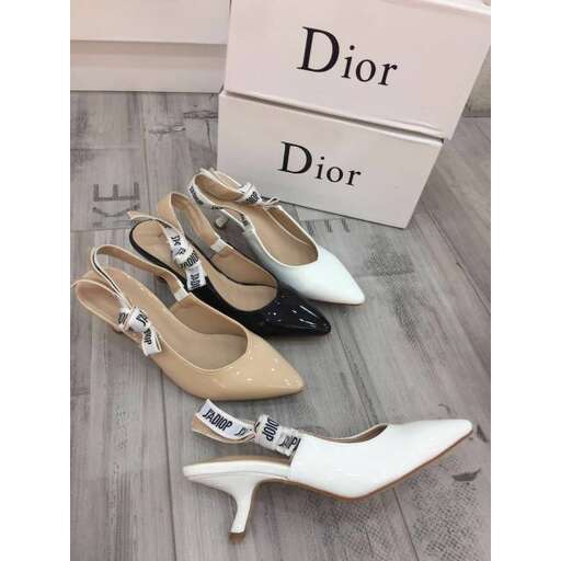 a pair of shoes with a touch of gold