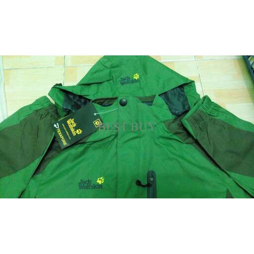 a green and black jacket with a tag