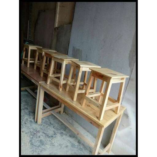 a wooden bench made from a wooden frame.