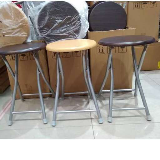 a set of stools with a plastic cover.