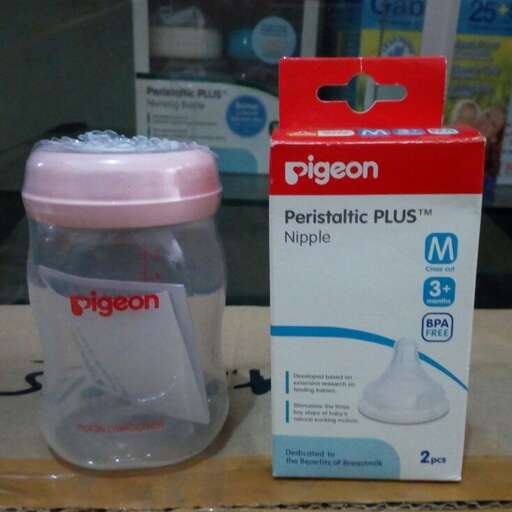 a bottle of baby wipes sits on a table.