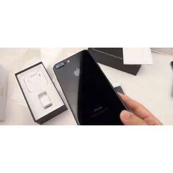 a person holding a smart phone in their hand.