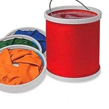 a red bucket with orange and blue paint and a red bucket.
