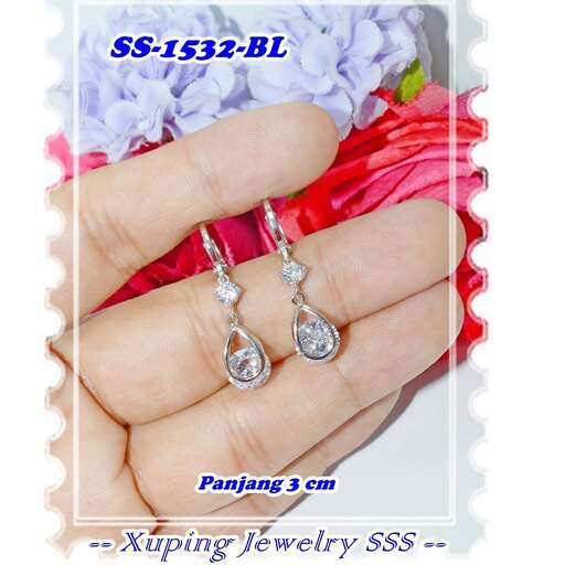diamond earrings in 18k white gold with diamonds in the middle.