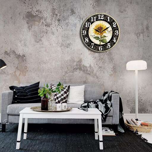 a living room with a couch, table, lamp and a plant.