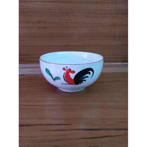 a bowl of chicken on a table