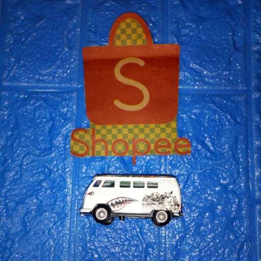 a paper mache sign with a car on it.