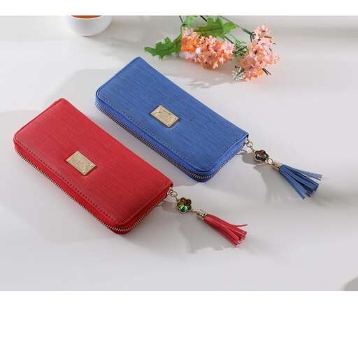 a pretty red wallet with a little bit of gold in the middle.