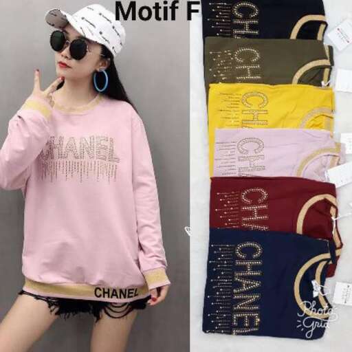 a pink long sleeved shirt with a white hat and black shorts