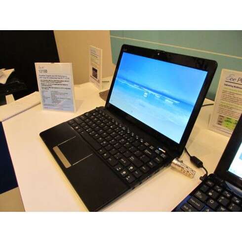 a laptop computer sitting on top of a white table.