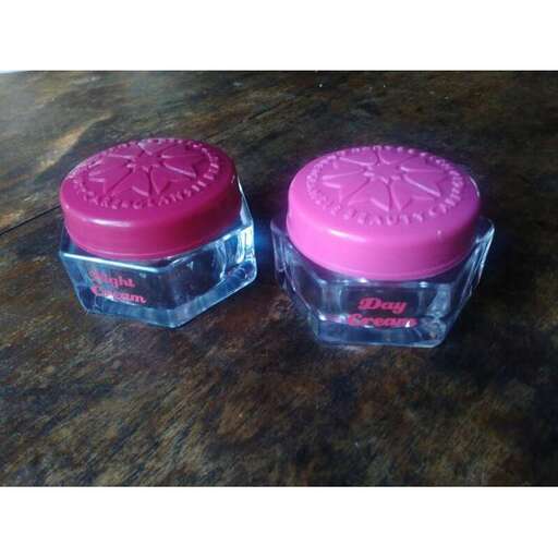 pink and purple perfume in a pink case