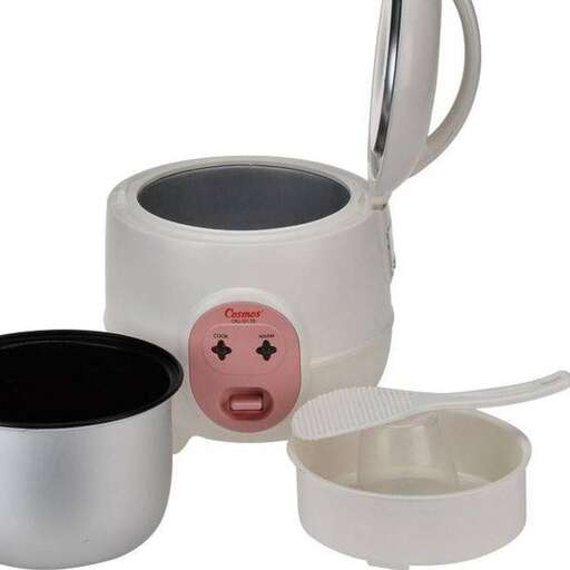 a white mug with a pink face on it.