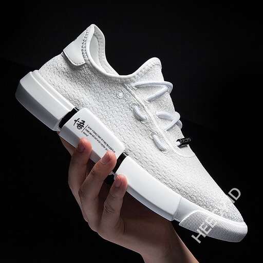the shoe is a sneaker that is made of white leather and is designed to look like a shoe
