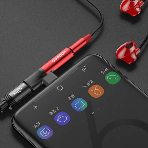 a smartphone with earphones plugged into it.