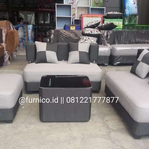 a living room with two couches and a chair.