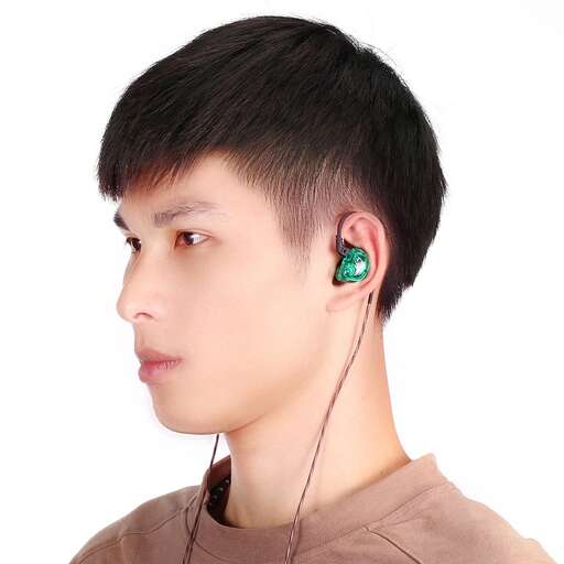 a man with a green earring in his ear