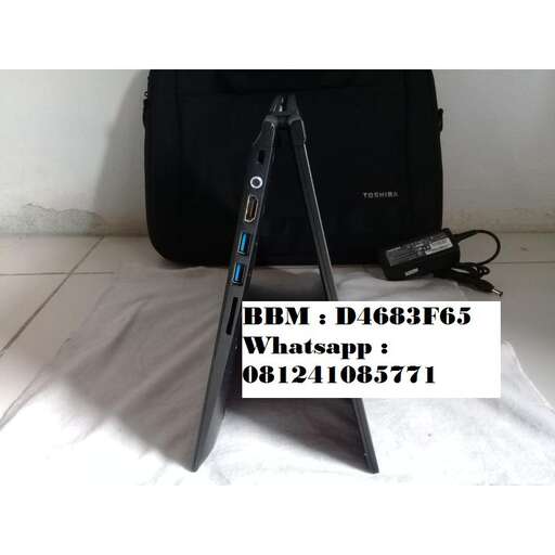 a picture of a laptop computer sitting on a floor.