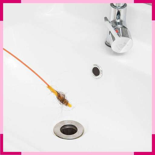 a sink with a faucet and a water faucet.