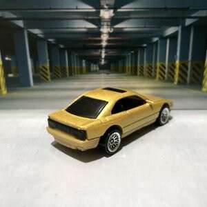 yellow car in the parking lot