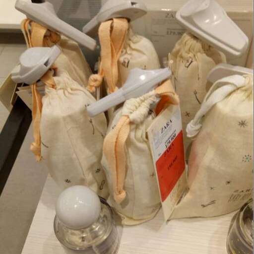 a glass jar with a handle