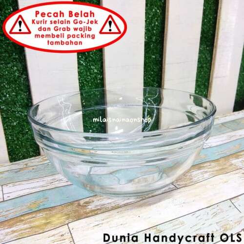 a glass bowl with a warning sign on it.
