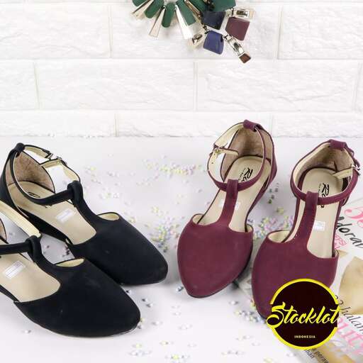 a pair of black women's shoes with gold and silver pumps.