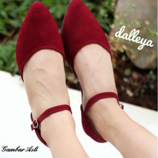 red high heeled shoes with a bow