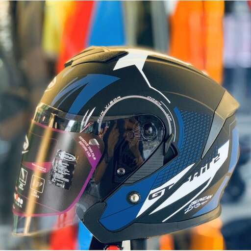 a motorcycle helmet with a white arrow on the inside.
