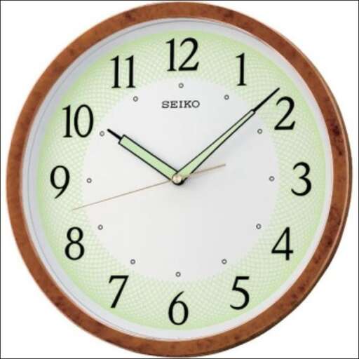 a clock with a brown frame and a white background