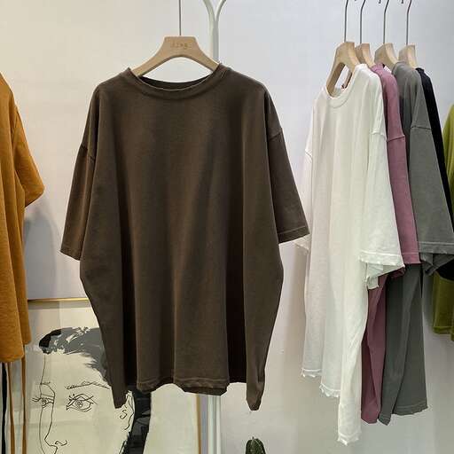 a rack of clothes hanging on a wall.