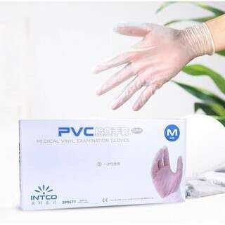 a woman's hand is in a box with a green plant.