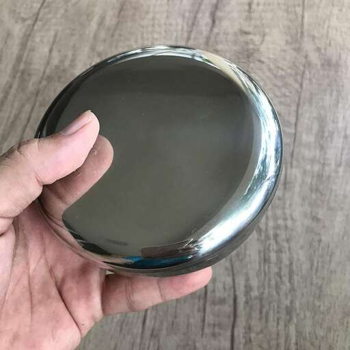 the glass is a very shiny metal piece that is used to hold the glass in place.