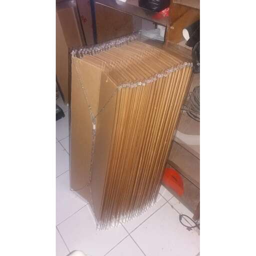 a stack of cardboard boxes sitting on top of a white tile floor.