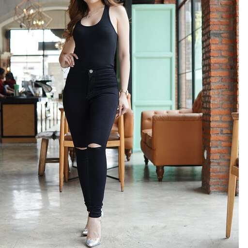 person in a black tank top and black leggings