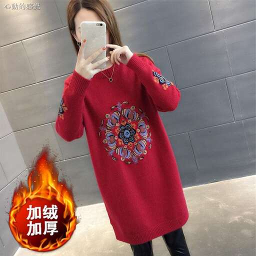 long sleeved red sweater with a floral design on the front