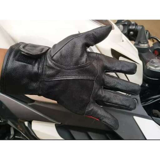 a glove that is on a motorcycle.