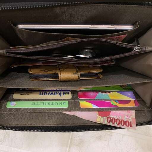 a laptop bag with a few items inside of it.