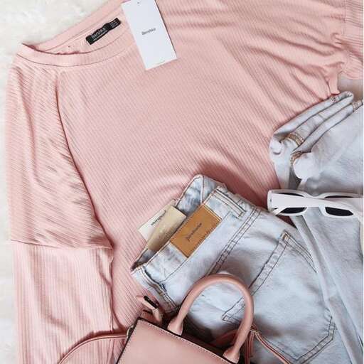 a pink sweater with a zipper and a pair of pink jeans