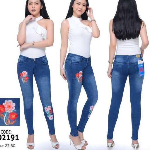 a model in a white tank top and jeans