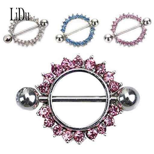 a set of earrings with a floral pattern and a silver plated ring.