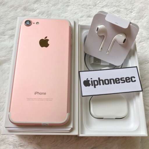 a pink iphone box with a sticker on it.