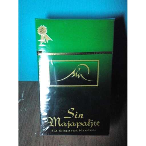 a book with a green cover and a black box